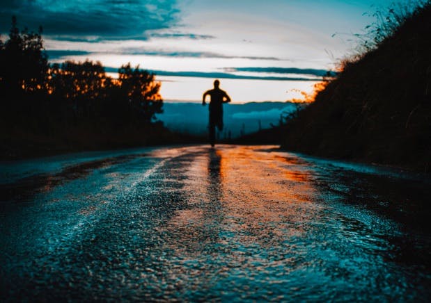 Man running in the sunset