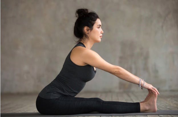Seated forward bend yoga pose