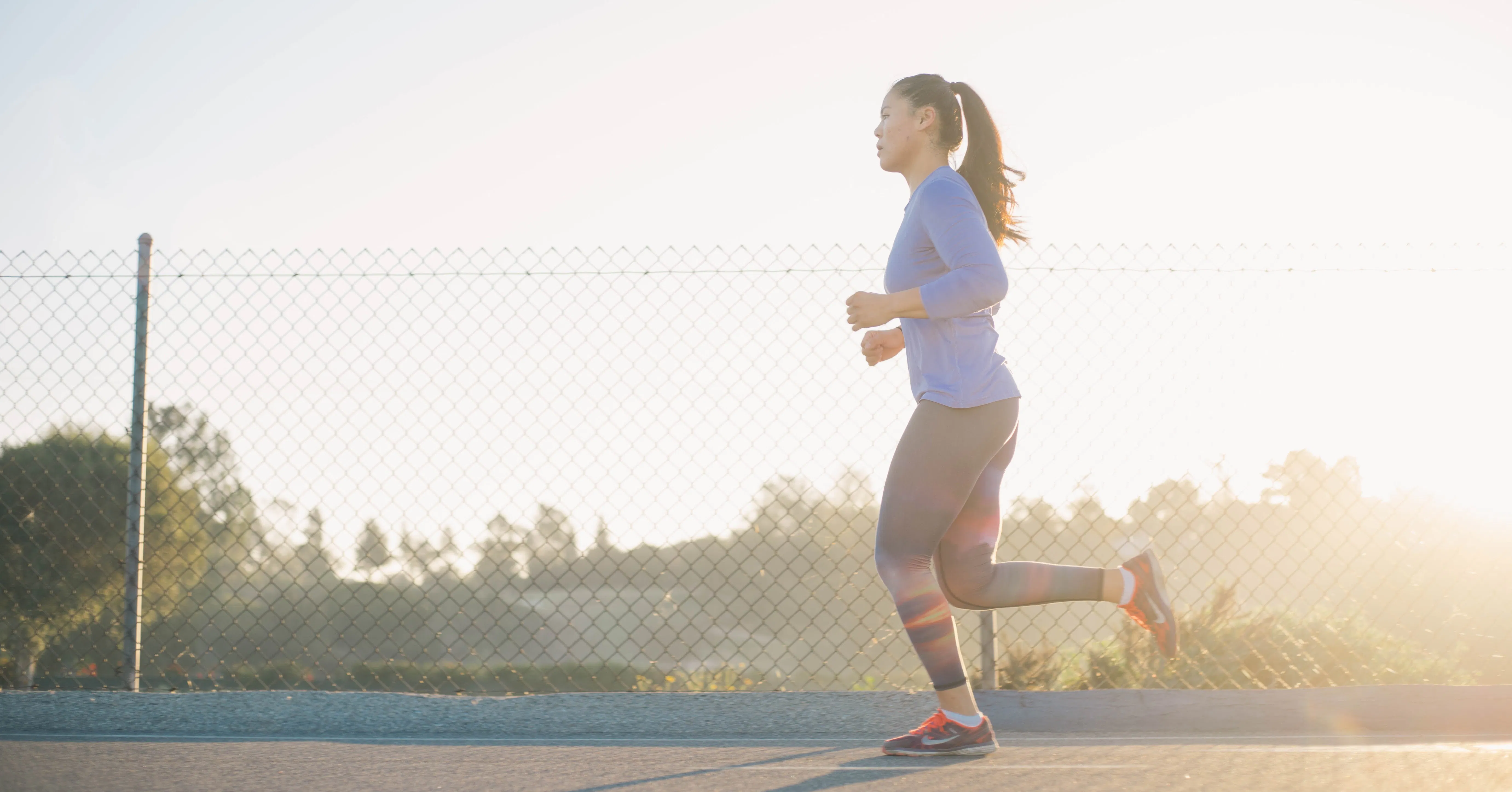 woman jogging on the road