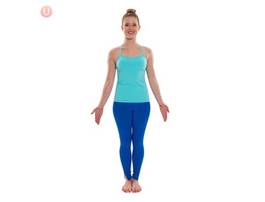 Woman doing the yoga mountain pose to relieve knee pain