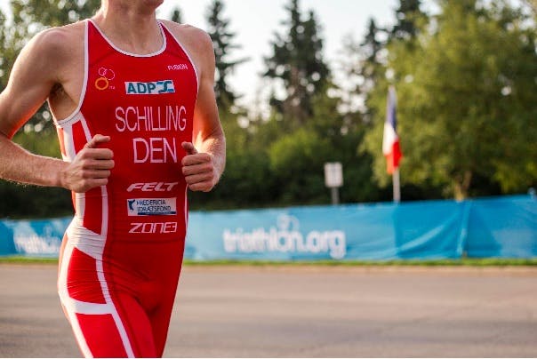 Man in red sports equipment, running a marathon