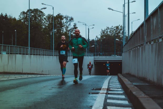 Men running a marathon in the city