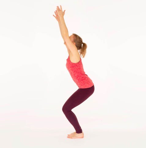 Woman doing the chair pose, a yoga position for bad knees