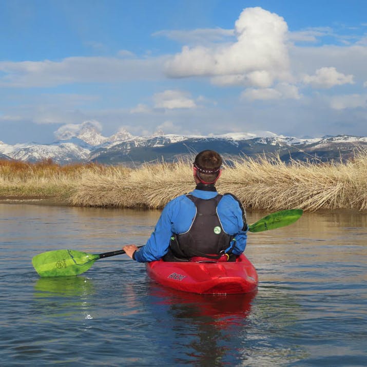 kayaker paddling the teton river