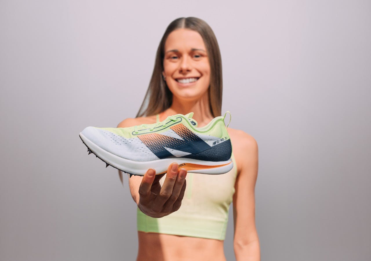 Jess holding New Balance spike