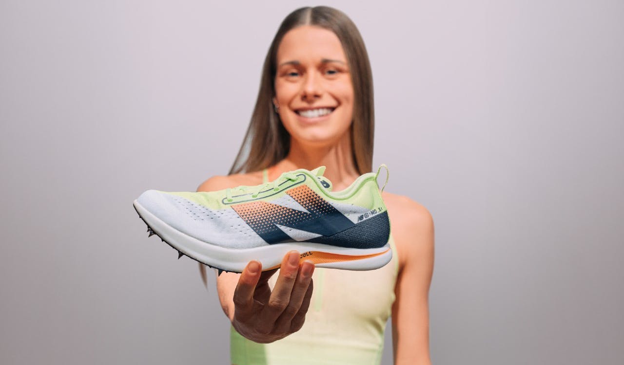 Jess holding New Balance spike