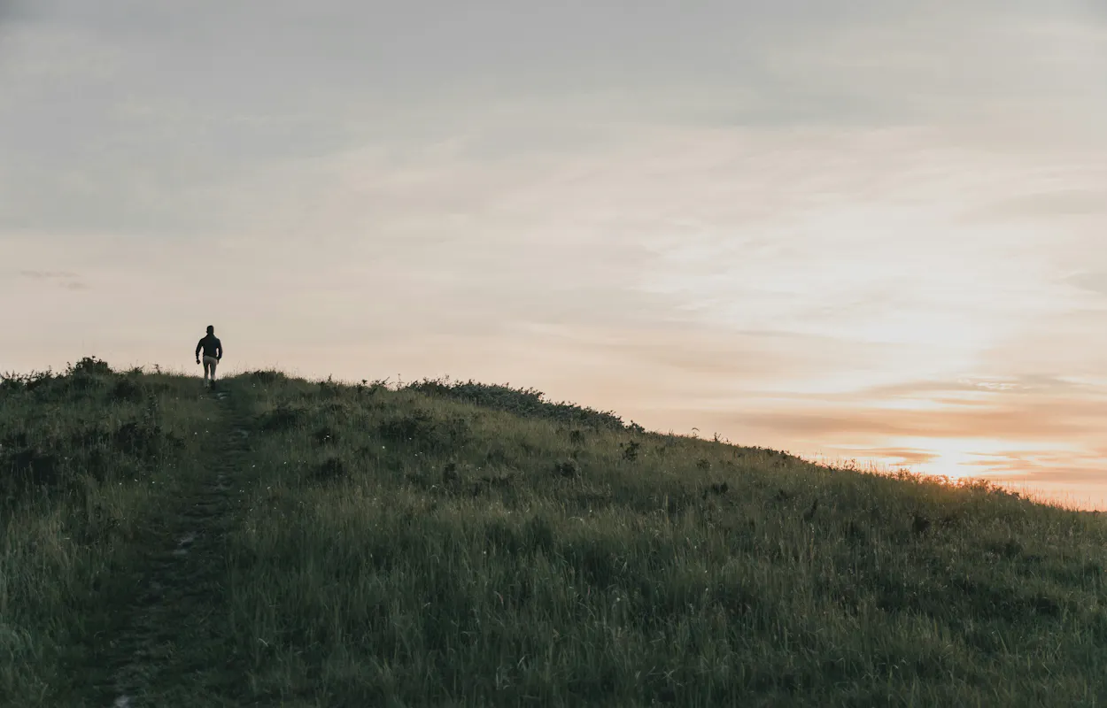 runner-on-top-of-hill