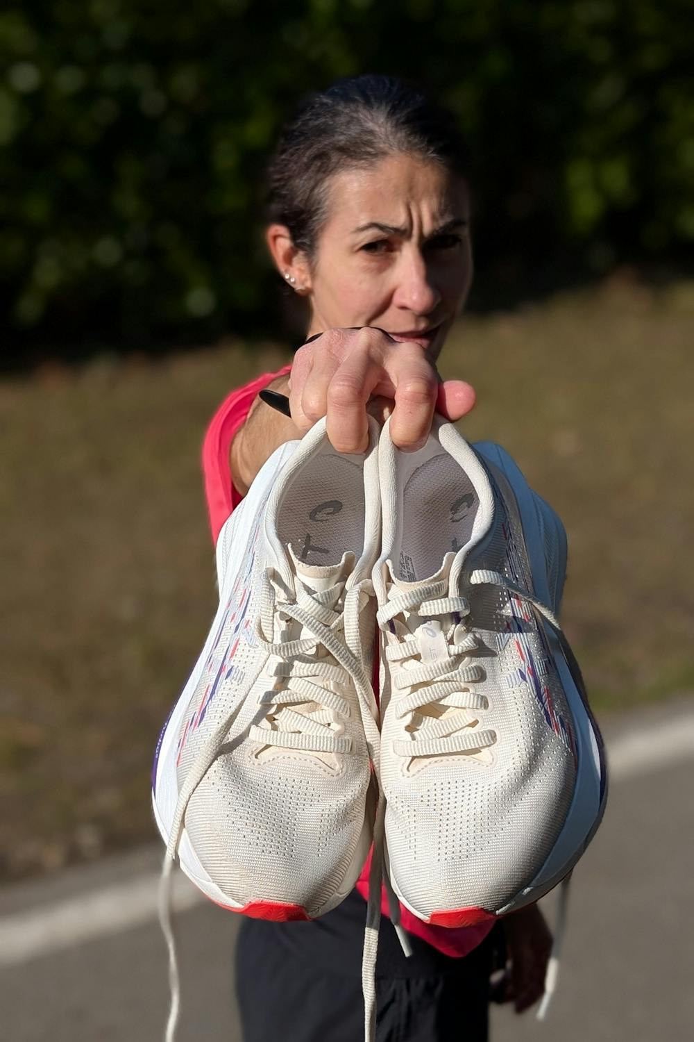 gloria-holding-asics-sonicblast-running-shoes