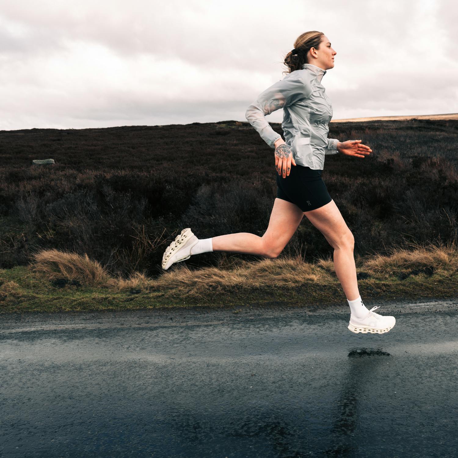Woman running in On Cloudmonster 3