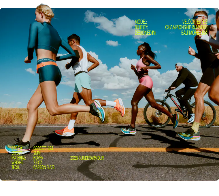 A diverse group of elite athletes running on an open road, showcasing the Under Armour Velociti Elite 3 racing shoes. The image highlights the 2026 collection’s carbon plate technology, HOVR+ cushioning, and lightweight 7.8 oz design for championship runners.