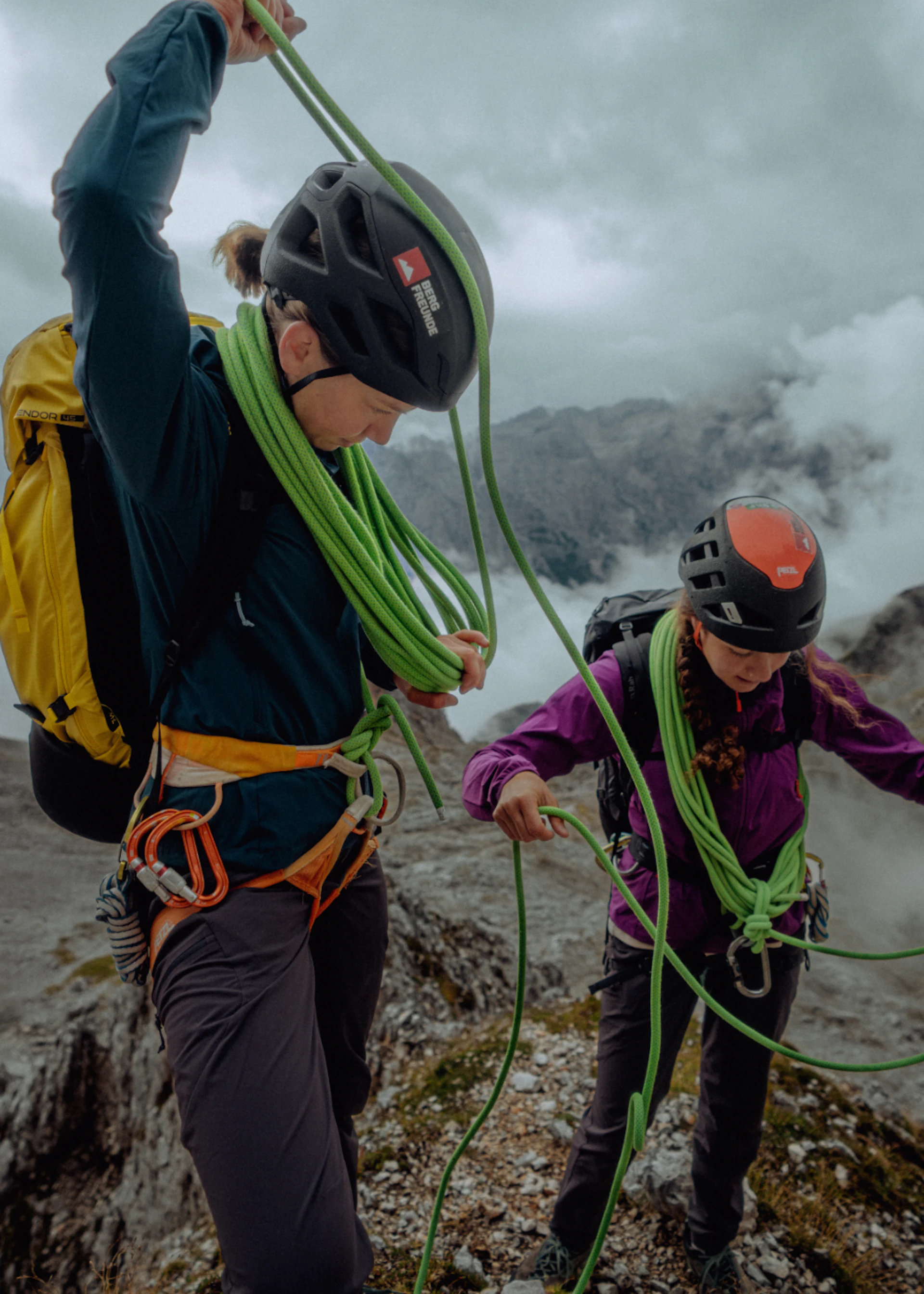 Two people with climbing rope on the mountain