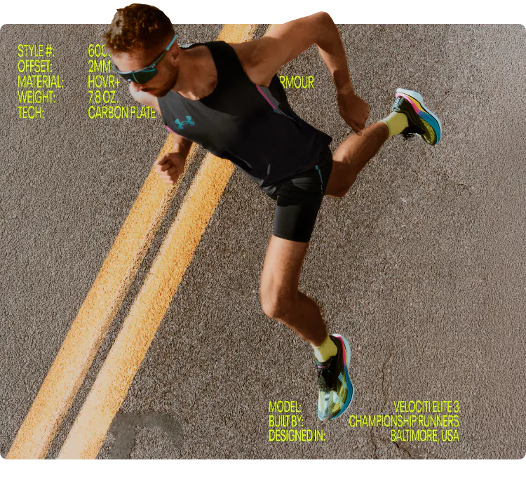 Overhead view of a male runner in Under Armour performance gear sprinting on an asphalt road for the UA Velociti Elite marathon shoe campaign.
