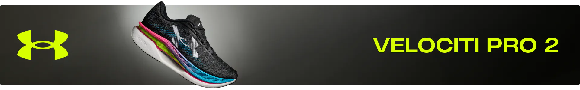 Under Armour Velociti Pro 2 neutral running shoe in black with vibrant pink, teal, and lime green midsole accents. Desktop banner showcases the sleek profile and UA HOVR cushioning technology.