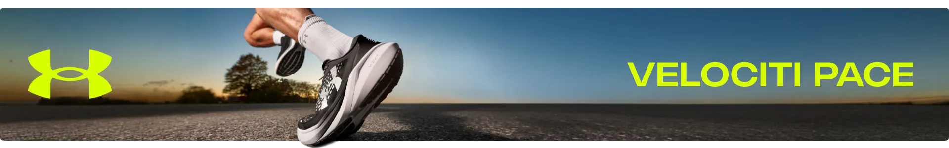 Under Armour Velociti Pace running shoe banner featuring a runner in motion on an open road at sunset. The shoe is shown in a classic black and white colorway with UA HOVR+ cushioning.