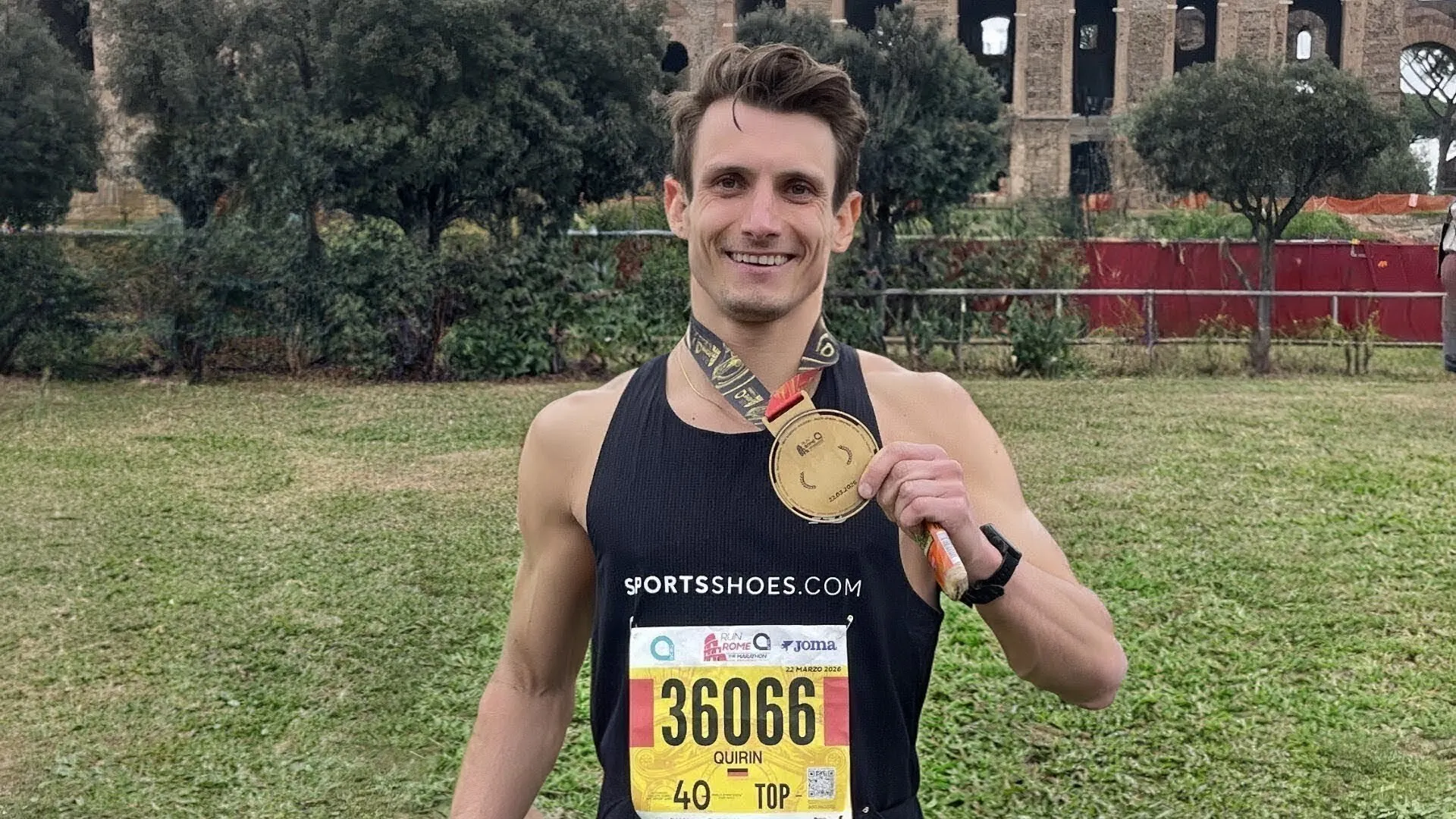 sportsshoes ambassador shows his rome marathon medal