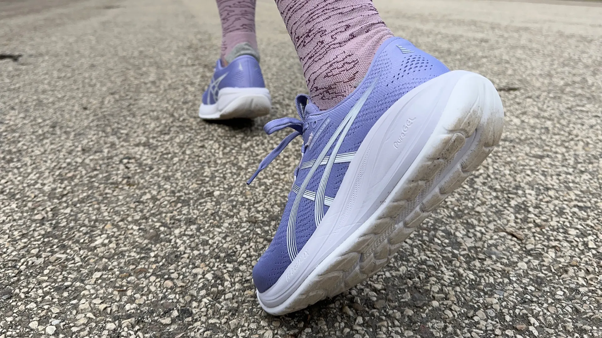 Close-up of ASICS Gel-Cumulus 28 running shoes on the road