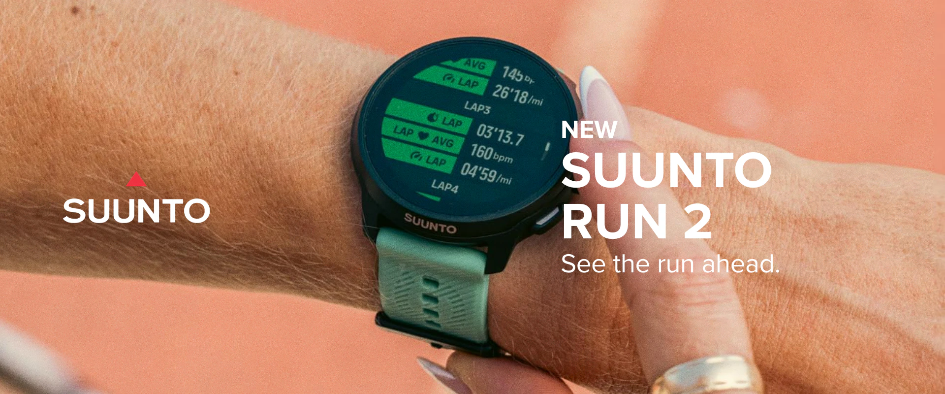 Runner interacts with the touch screen of the Suunto Run 2 GPS running watch
