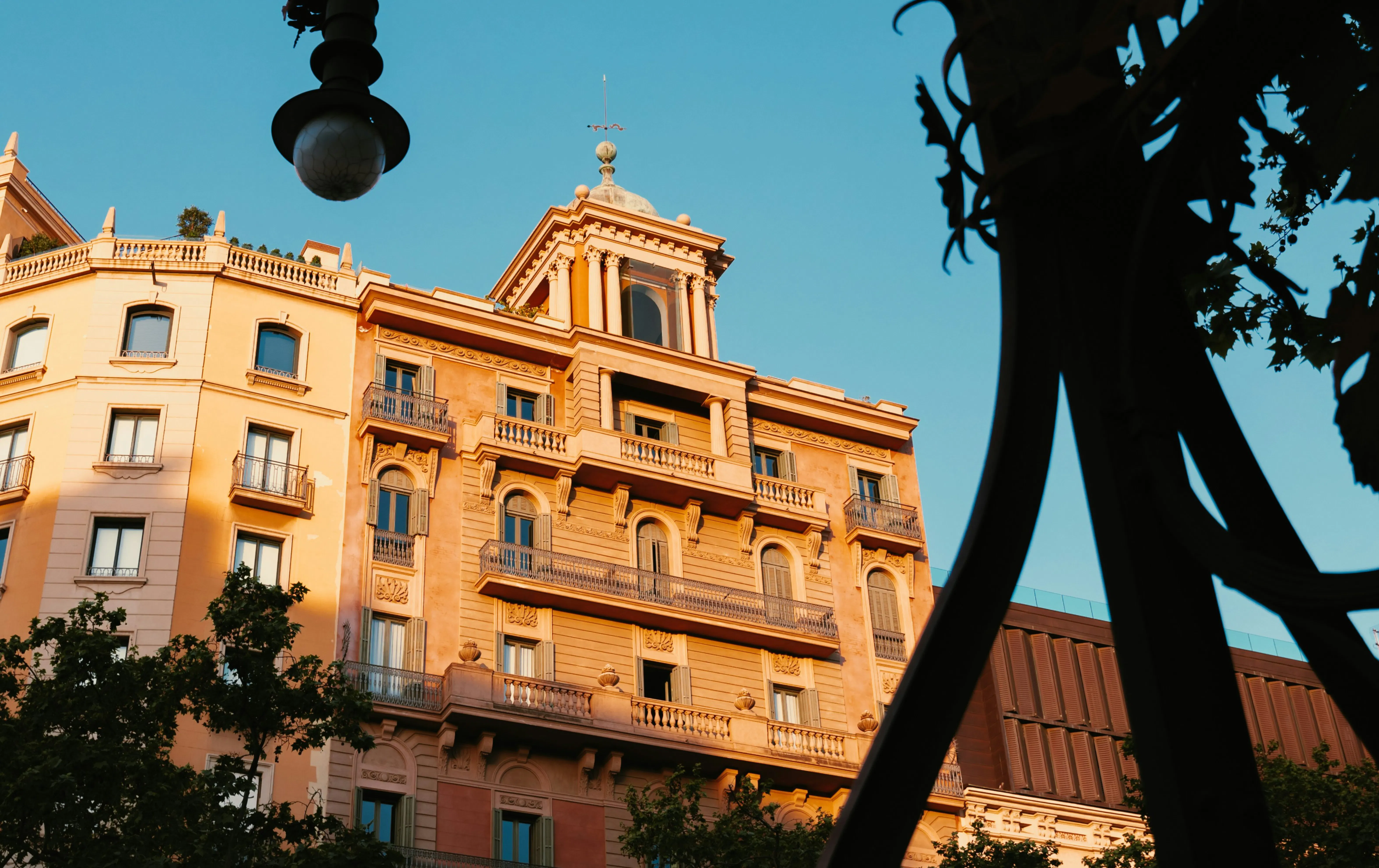 Historic residential building in Barcelona in warm evening light, representing the city’s property market and homes for sale.
