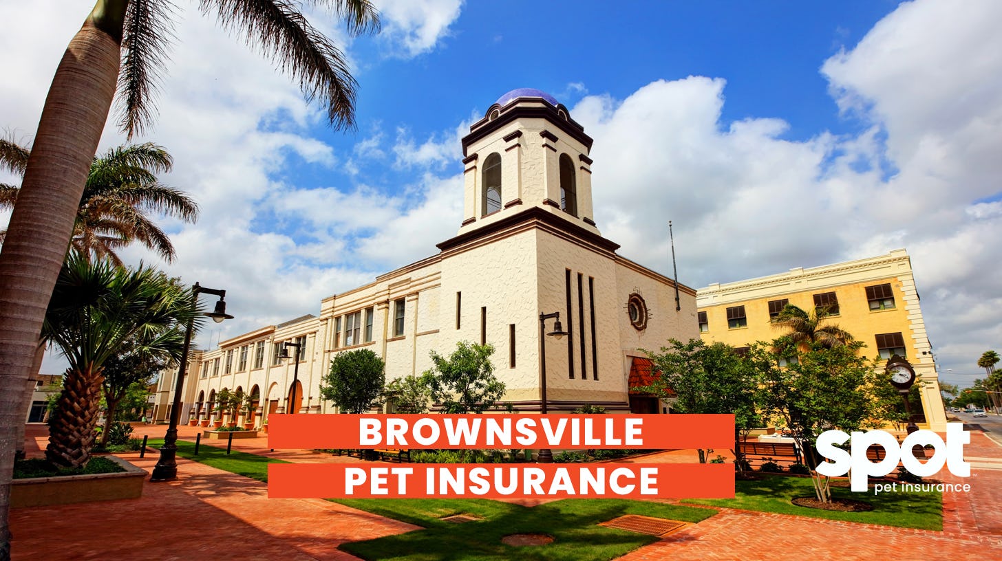Picture of a large building with clouds in the background