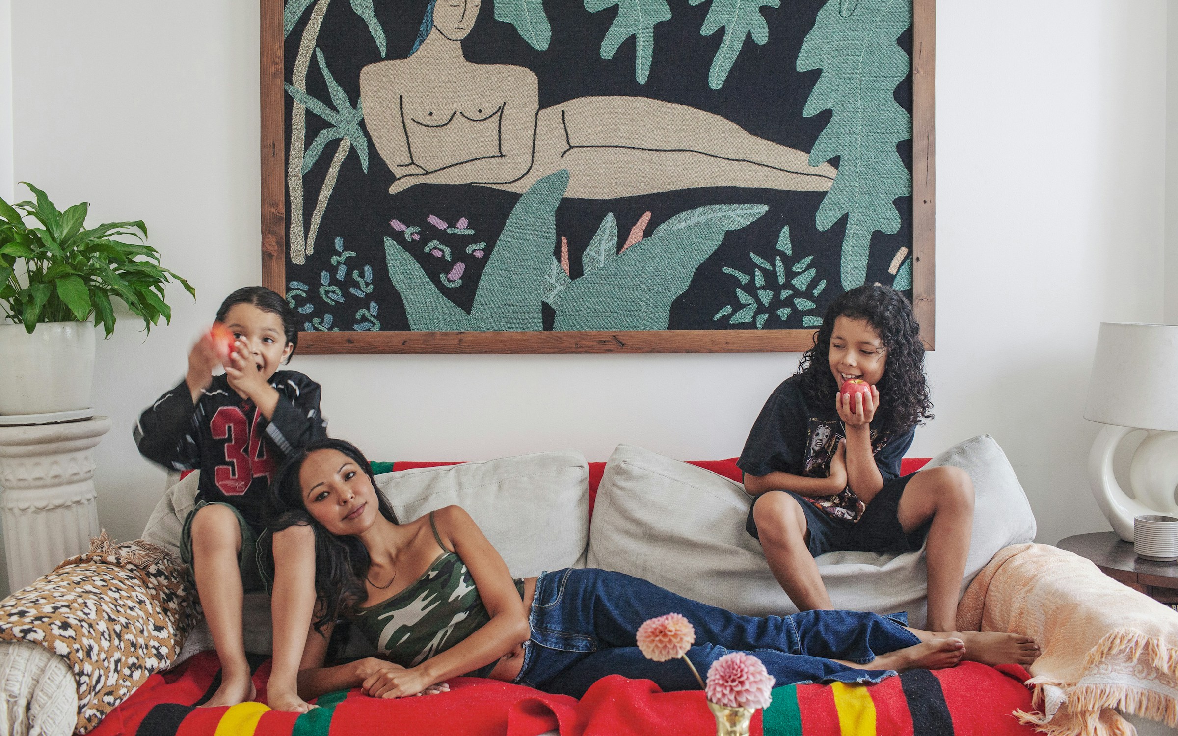 mom on couch with two sons