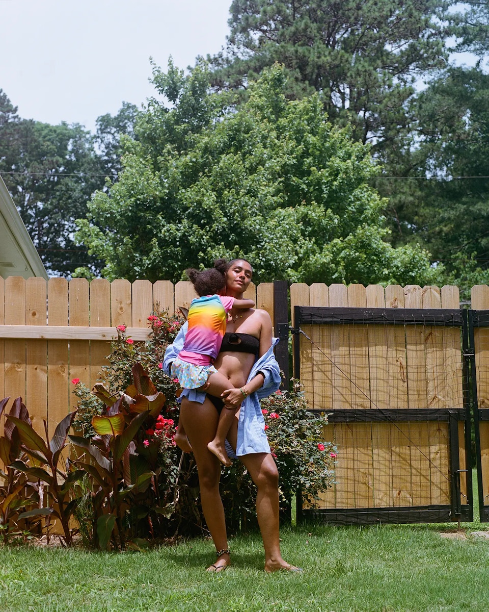 mom holding daughter in arms