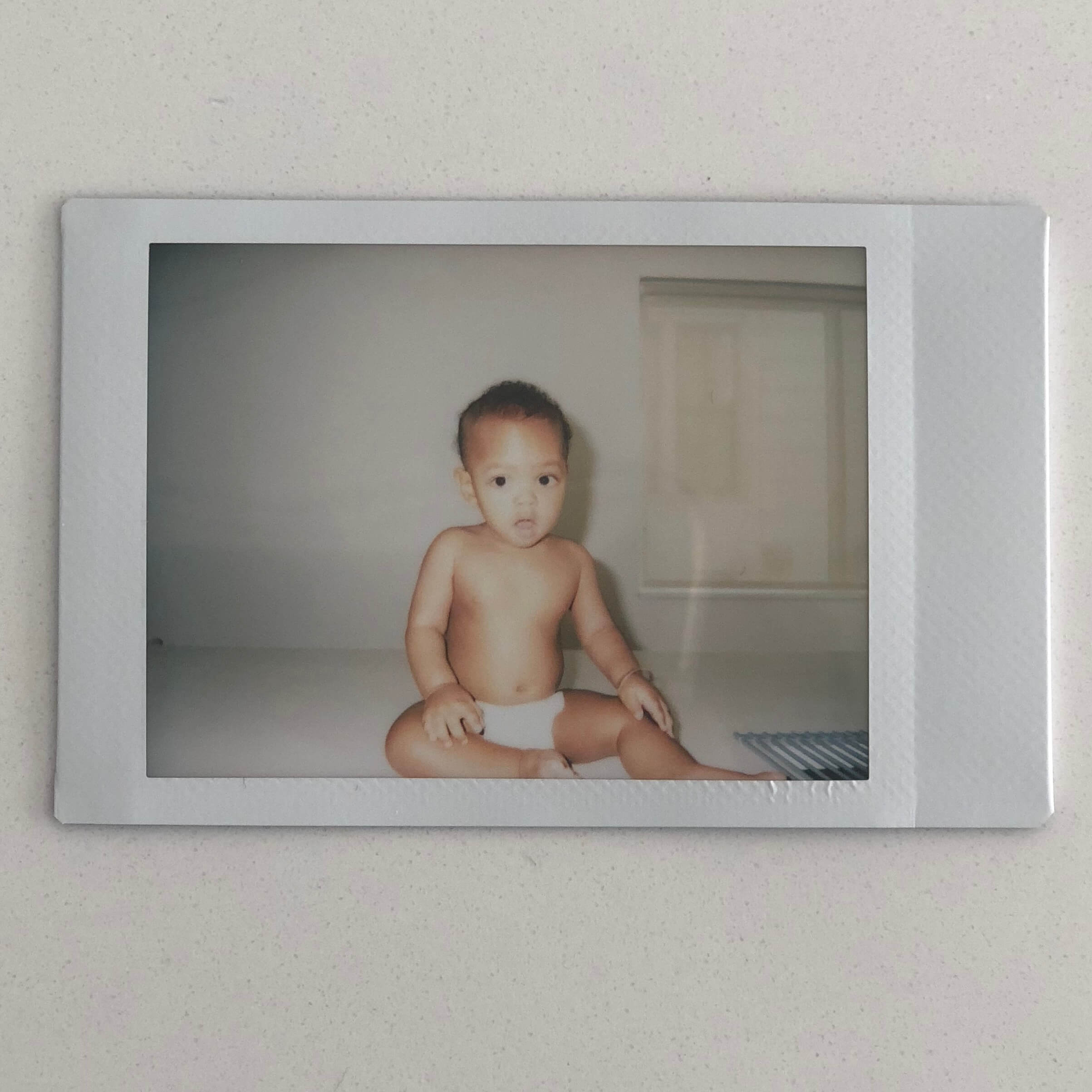 polaroid of a baby girl
