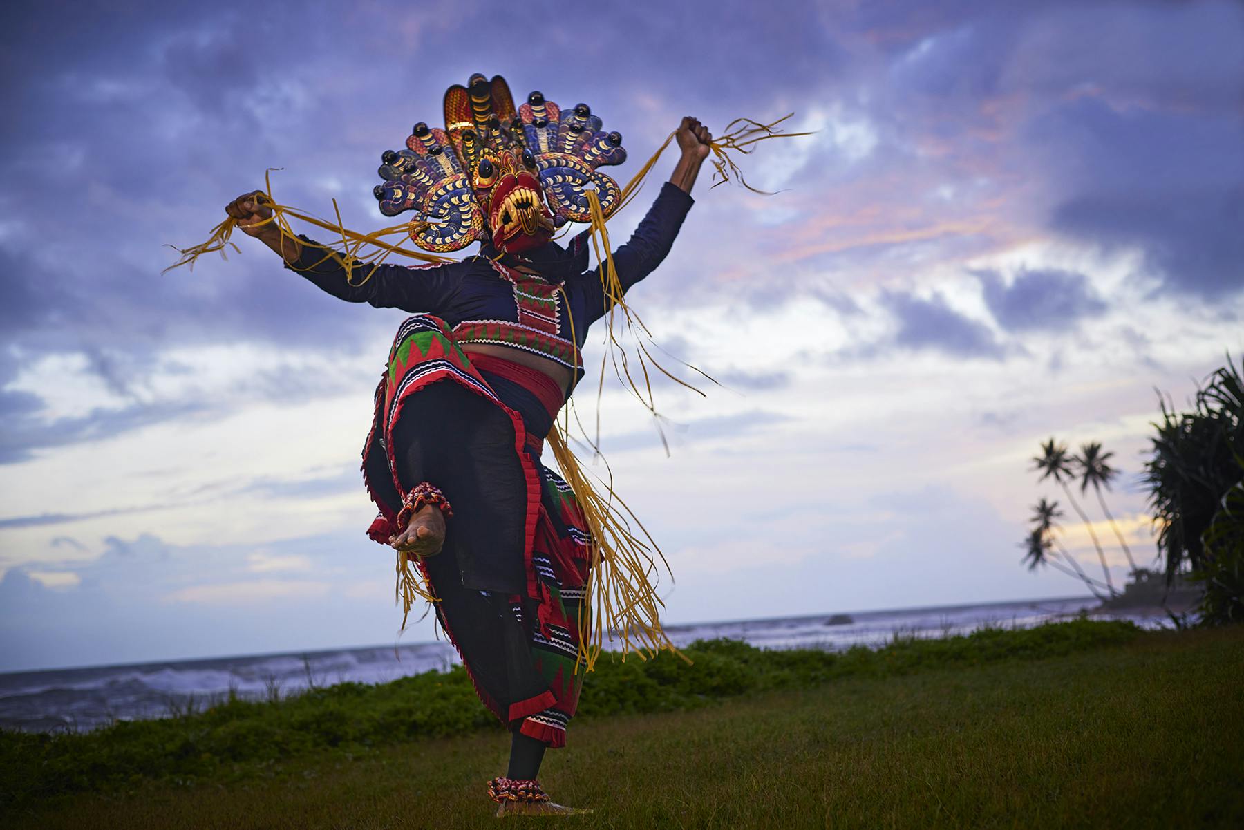 A dancer wearing a mask of Ambalangoda.