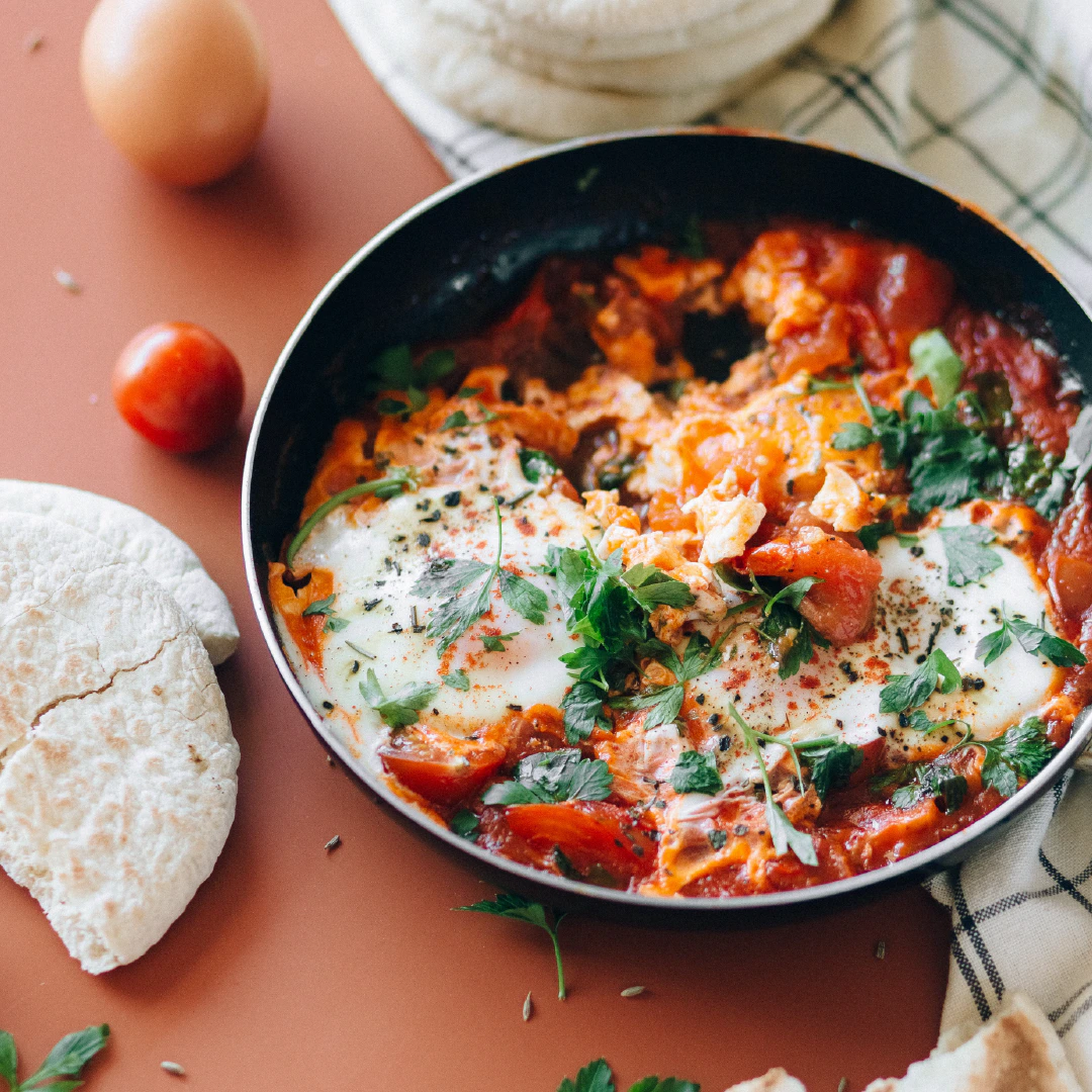 Parsley on fresh baked eggs