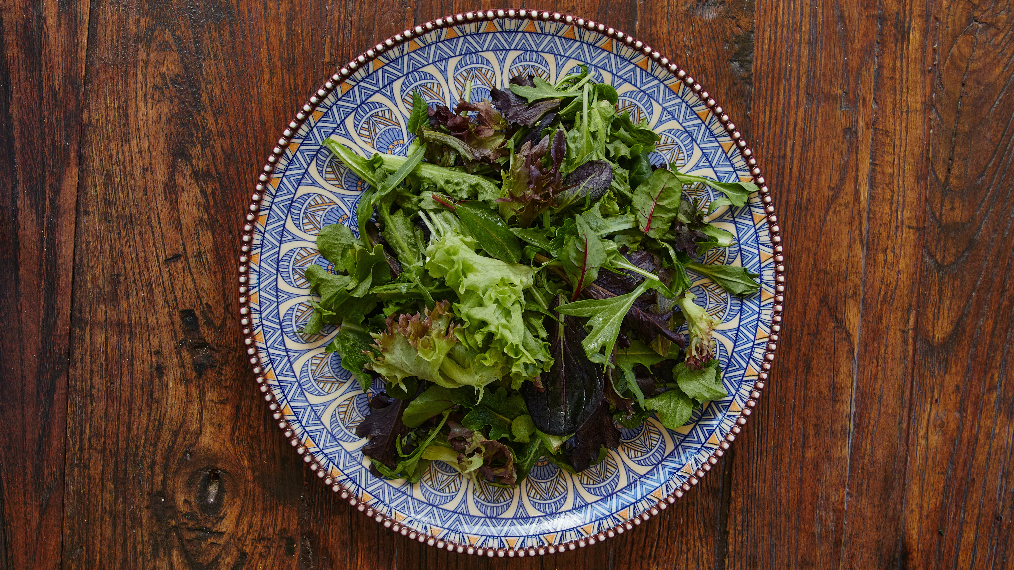 Fresh stacked farm mixed leaf on a plate
