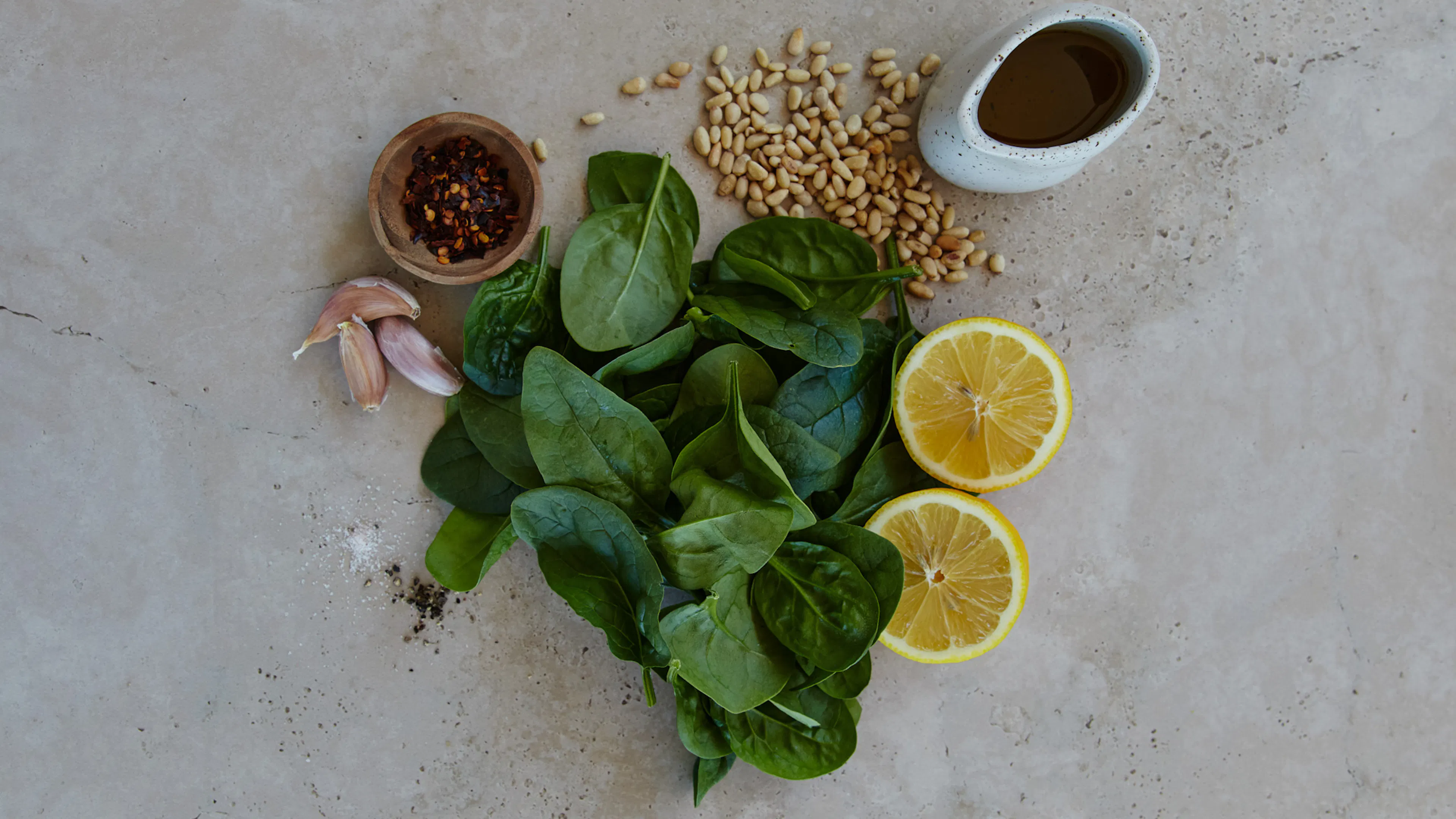 Garlic Sautéed Spinach with Chilli, Lemon & Toasted Pine Nuts ingredient flatlay