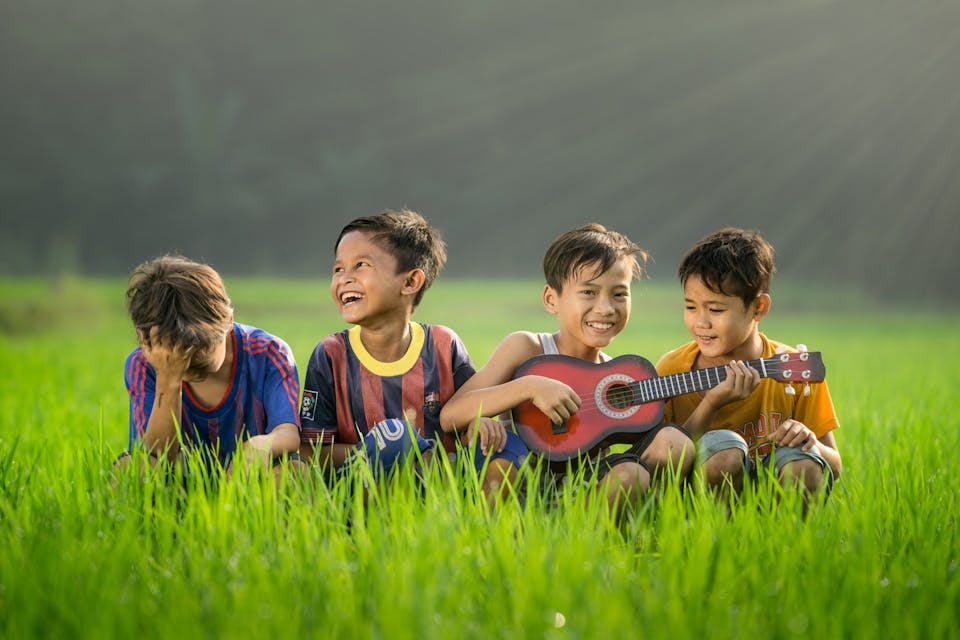 Children playing the guitar
