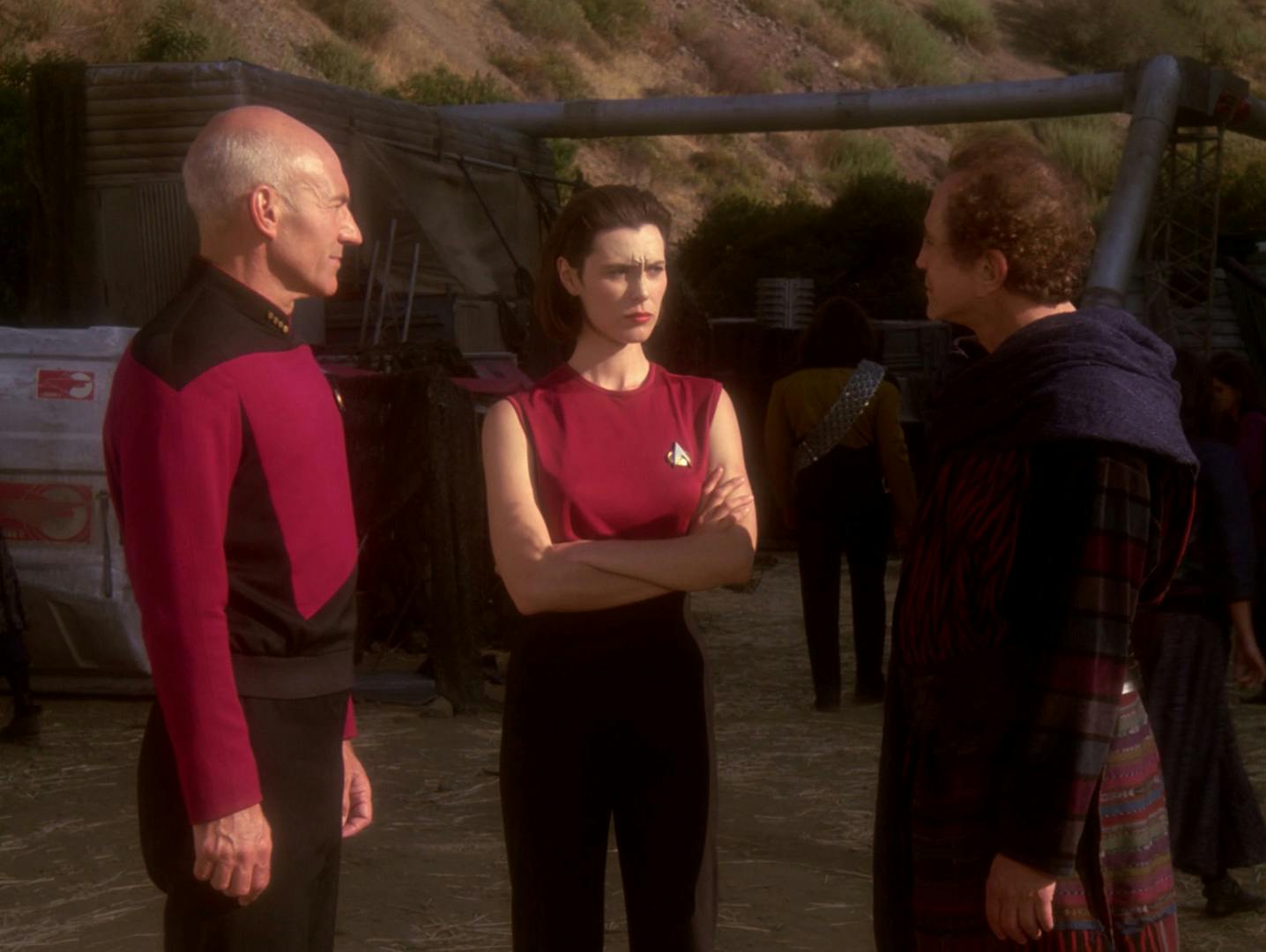 Jean-Luc Picard and Ro Laren approach Keeve on the surface of Valo II in 'Ensign Ro'