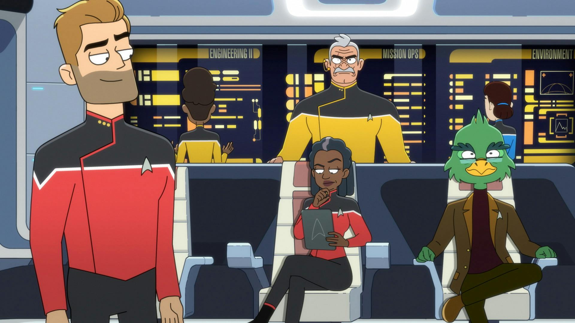 Ransom on the bridge looking at Captain Freeman, seated in her captain's chair, with Shaxs standing behind her and Dr. Migleemo seated next to her, as seen in Star Trek: Lower Decks 401 'Twovix'