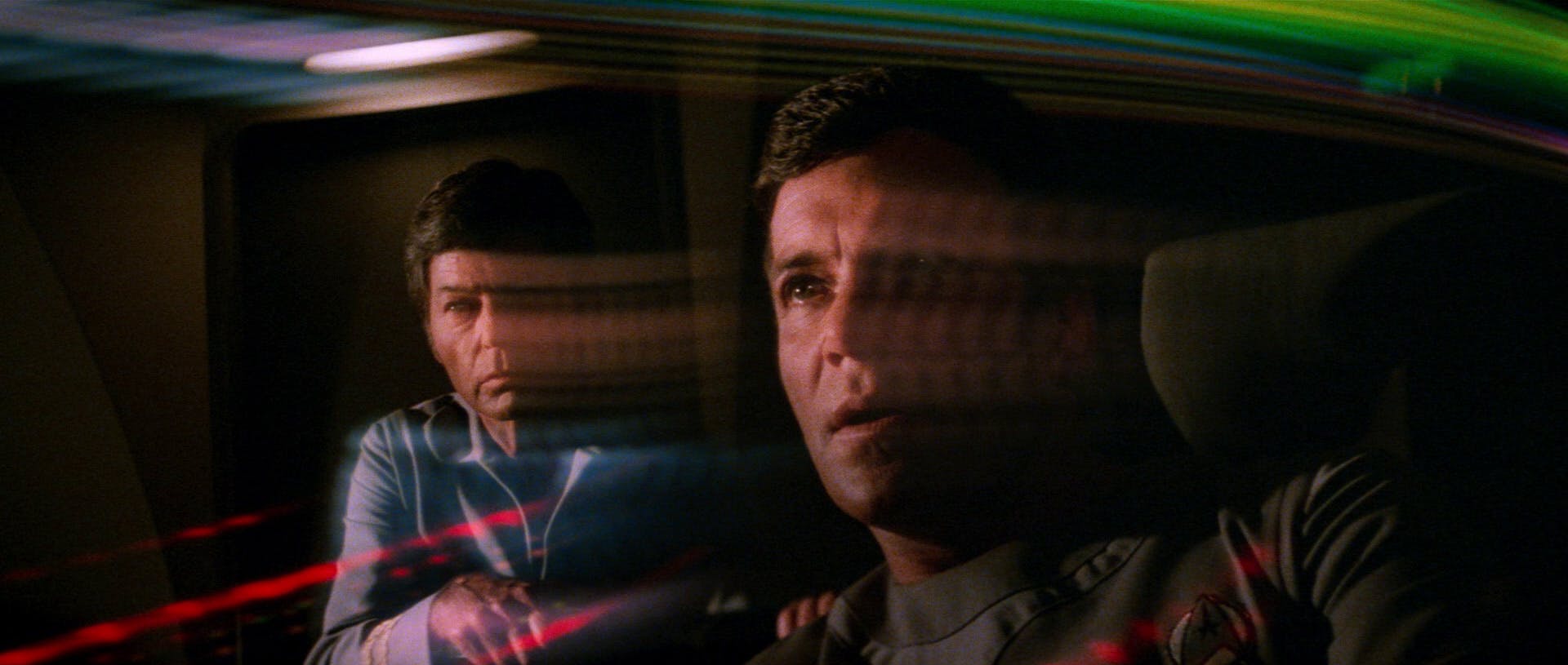 McCoy and Kirk endure the effects passing through a wormhole on the bridge of the Enterprise in Star Trek: The Motion Picture