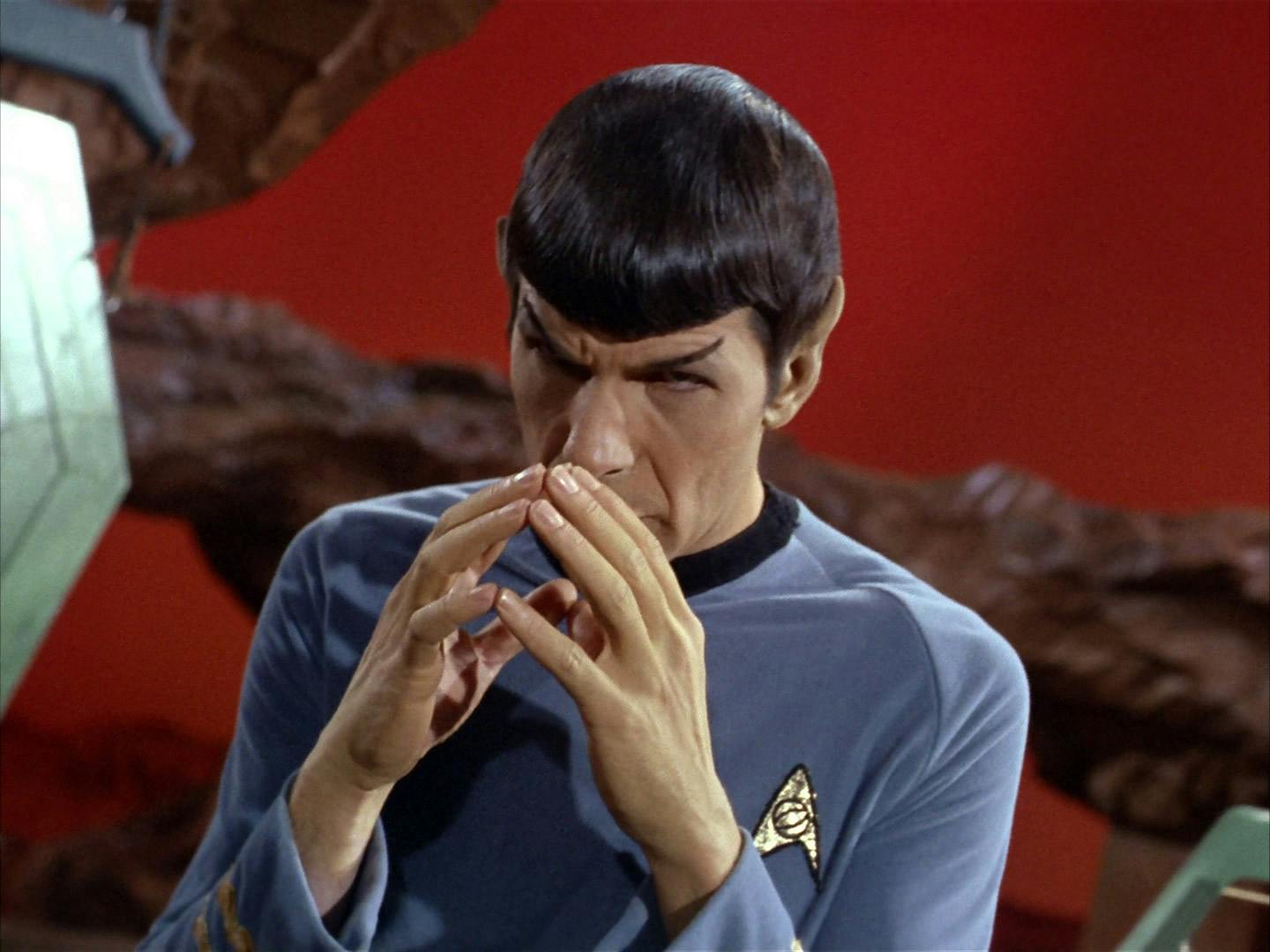 Experiencing pon farr, on Vulcan, Spock with his face to his hands, is in plak tow, or 'blood fever' in 'Amok Time'