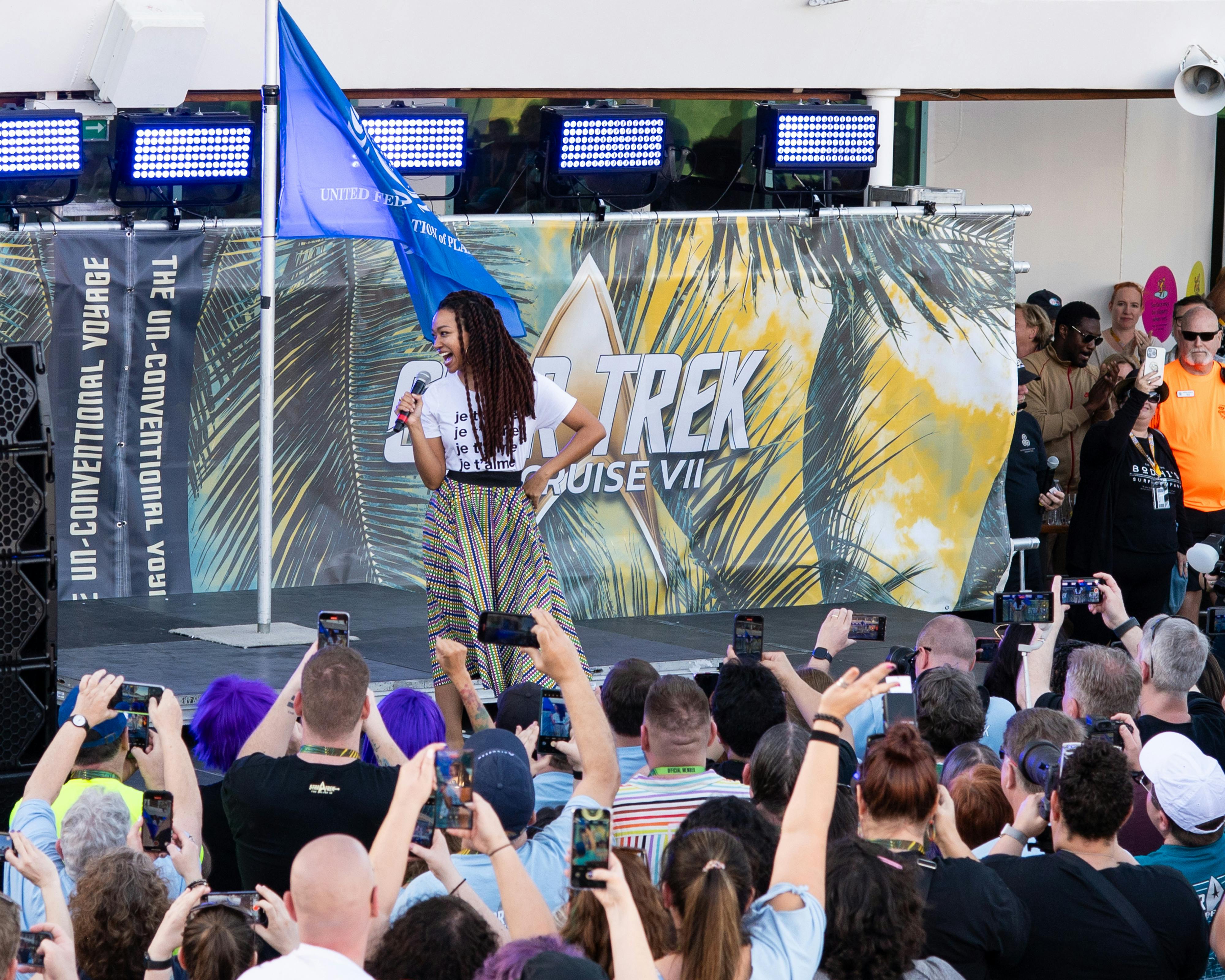 Sonequa Martin-Green greets the crowd at the sail away party at Star Trek: The Cruise VII