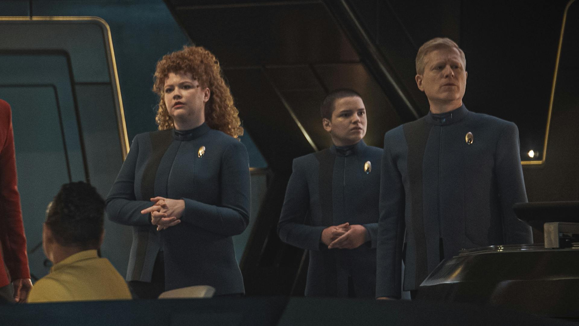 On the Bridge, Tilly, Stamets, and Adira are all concerned look in different directions in 'Mirrors'