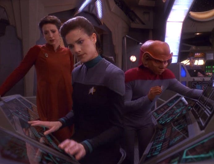 Nog assists Kira and Dax unscramble a recorded message on Deep Space 9 in 'The Darkness and the Light'
