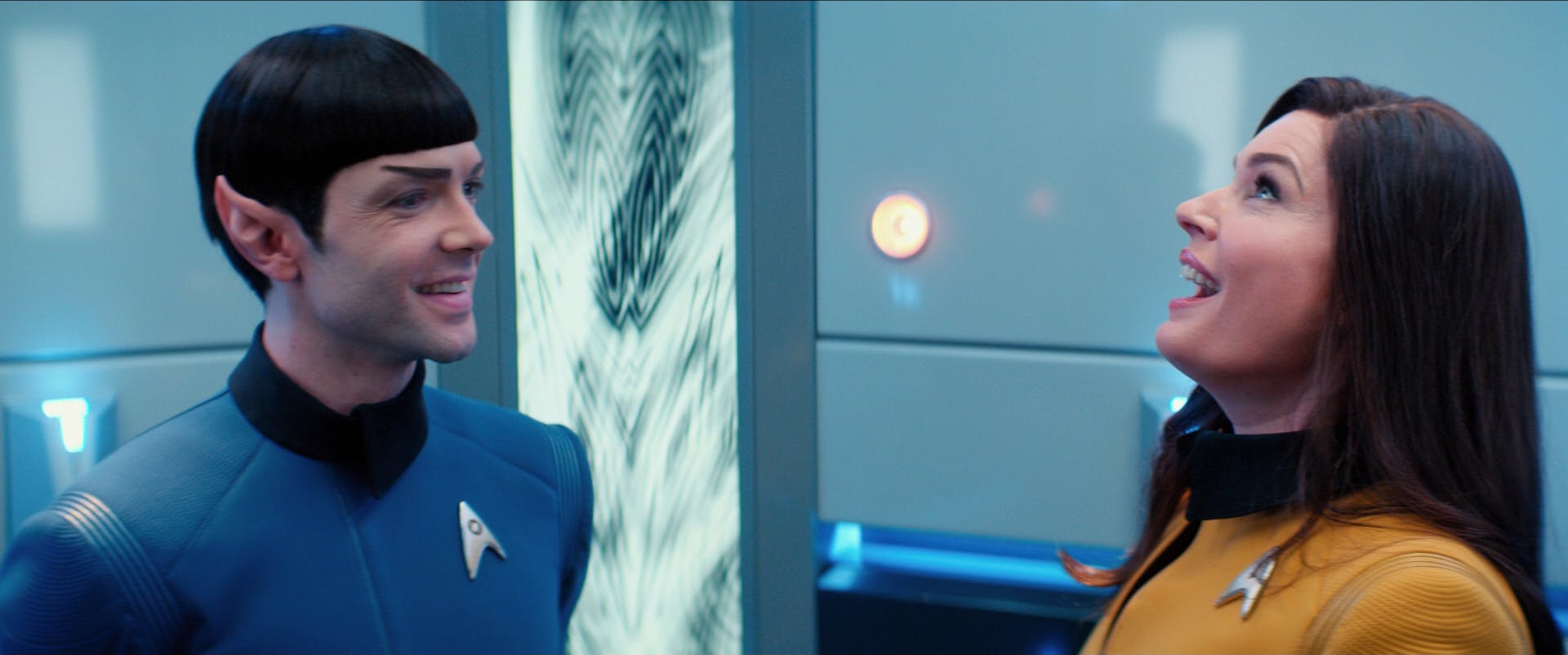 Number One (Una) sings Gilbert and Sullivan while stuck in the turbolift with Spock who smiles at her in the Short Treks' 'Q&A'