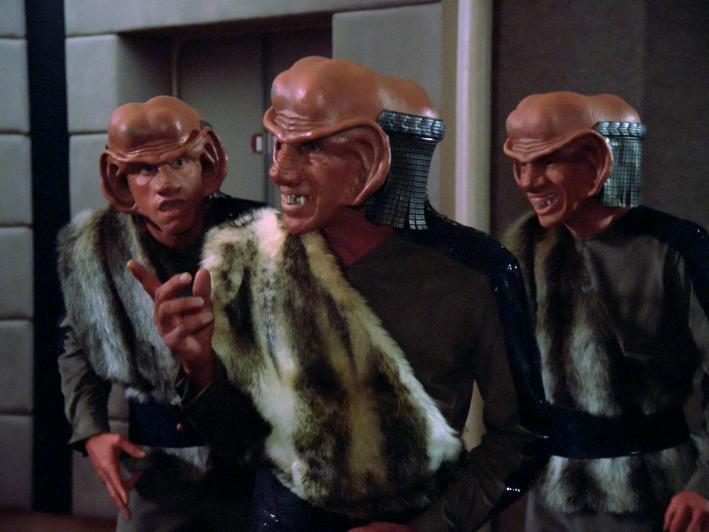 Three Ferengi board the U.S.S. Enterprise bridge to speak with Captain Jean-Luc Picard in 'The Battle'