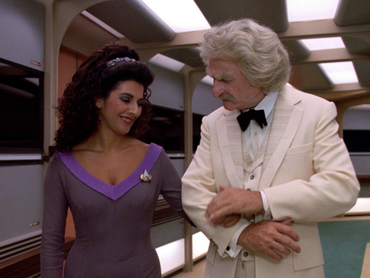 Deanna Troi accompanies Mark Twain around the Enterprise-D corridor in the 24th Century in 'Time's Arrow, Part II'