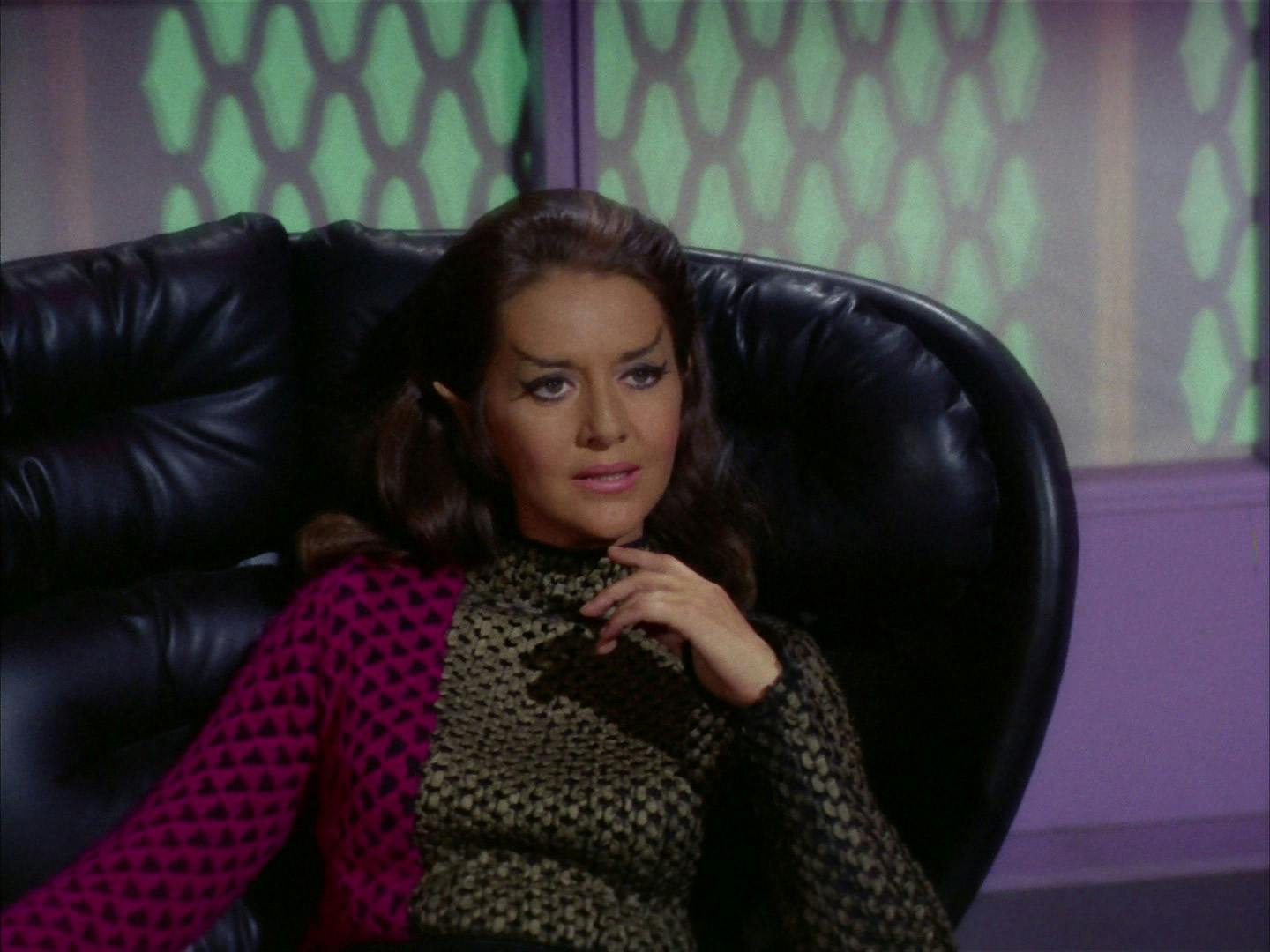 The Romulan commander sits comfortably in her seat in 'The Enterprise Incident'