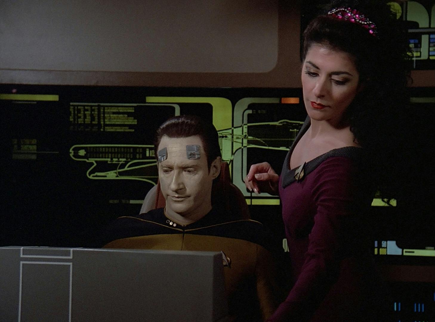 Deanna Troi performs a psychotronic stability examination on Data in his quarters in 'The Schizoid Man'