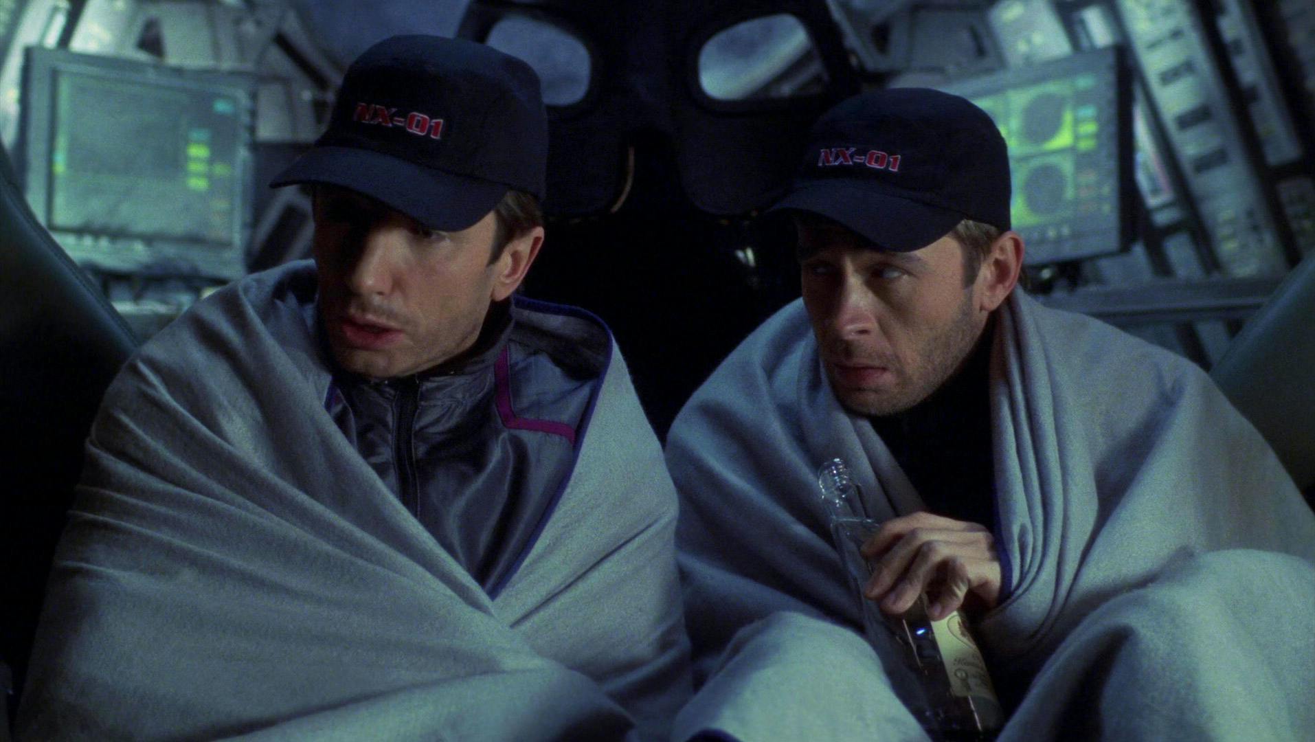 With life support dwindling on their shuttlepod, Reed and Trip Tucker bundle up while sharing a bottle of booze in 'Shuttlepod One'