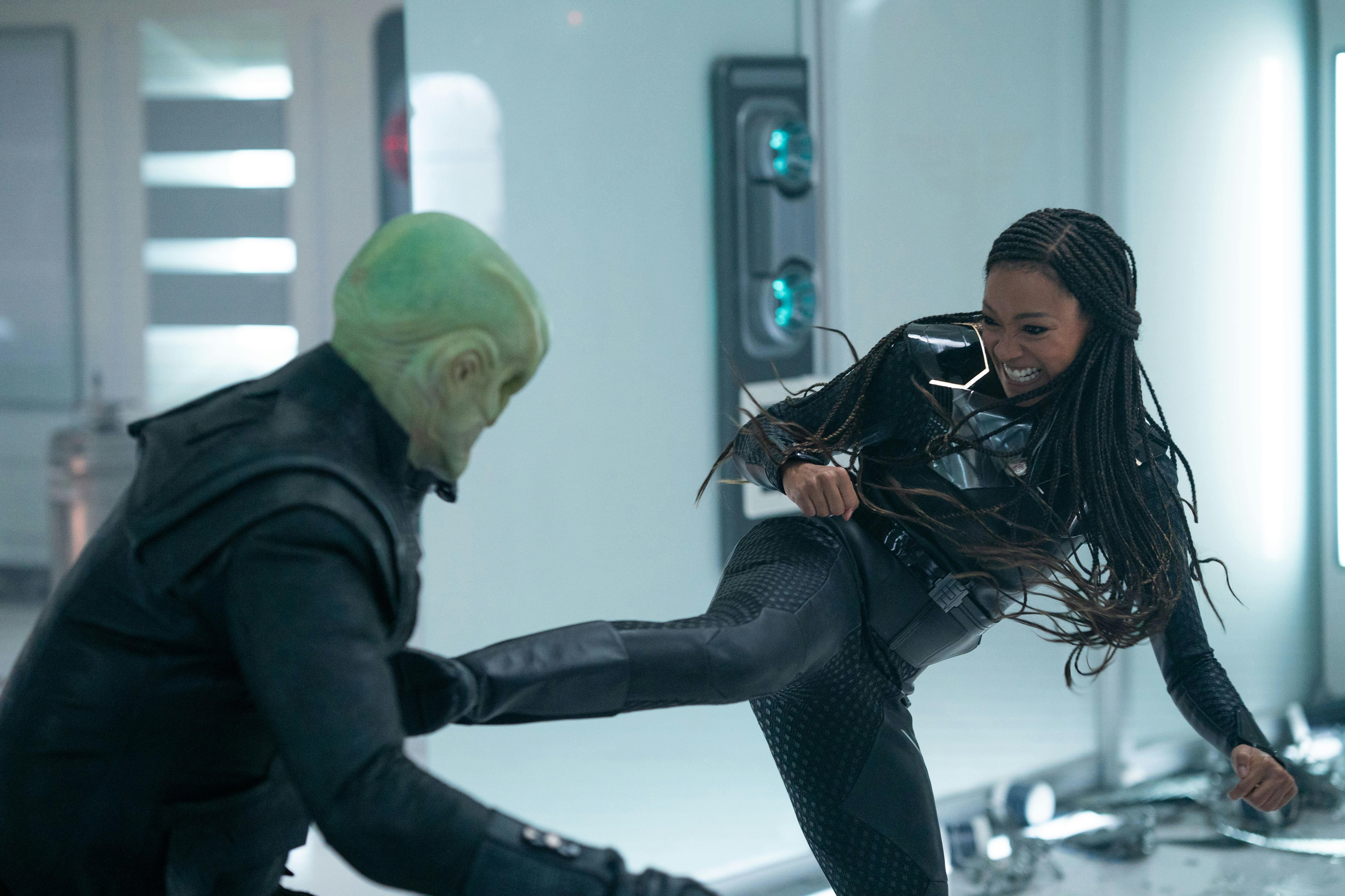 Brawling in the I.S.S. Enterprise's Sickbay, Michael Burnham kicks L'ak in the chest in 'Mirrors'