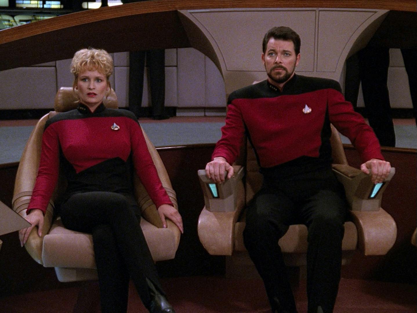 Shelby sits besides Riker in the captain's chair as they show grave concern of what they see on the viewscreen in 'The Best of Both Worlds Part II'