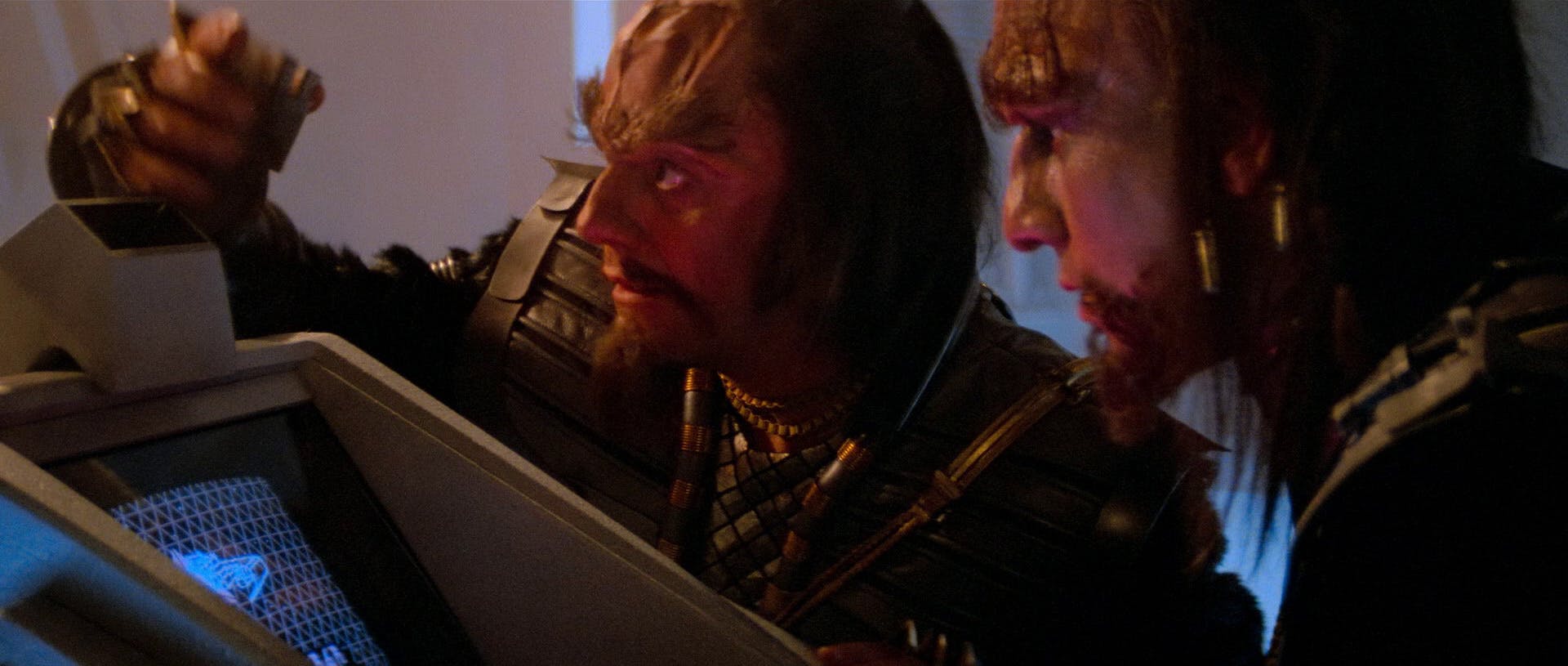 Hovering above a station's monitor, Kruge and a fellow Klingon warrior learn about the Project Genesis on-screen in 'Star Trek III: The Search for Spock'