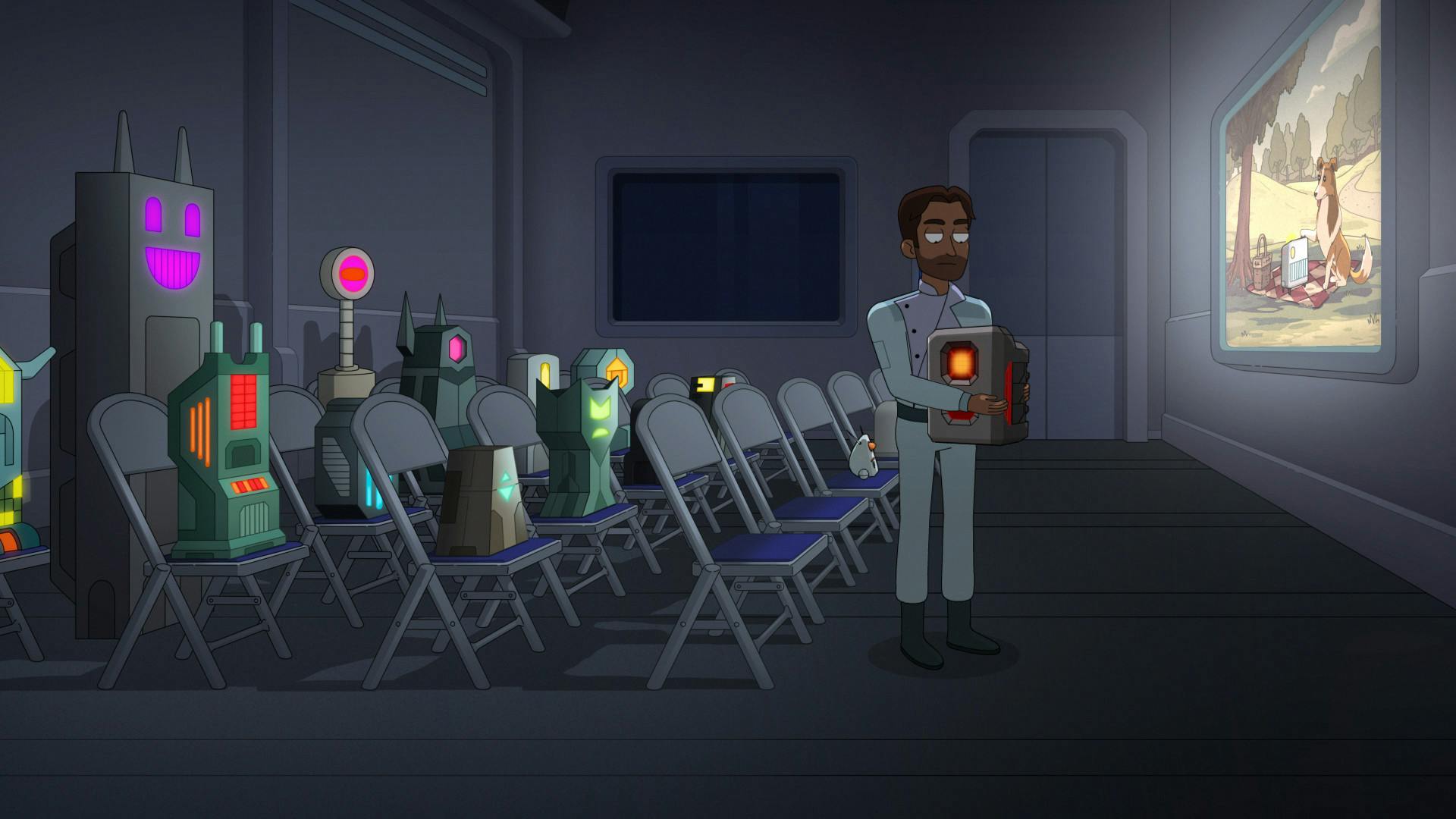 In a screening room at Daystrom Institute, several tower-like prisoners are watching a movie where a computer is speaking to a dog on a picnic in the park as a guard steps in and picks up Agimus