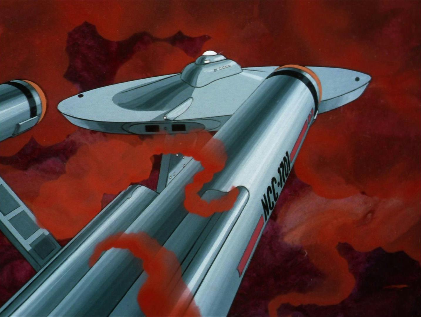 The Enterprise is enveloped by a red cosmic cloud in 'One of Our Planets is Missing'