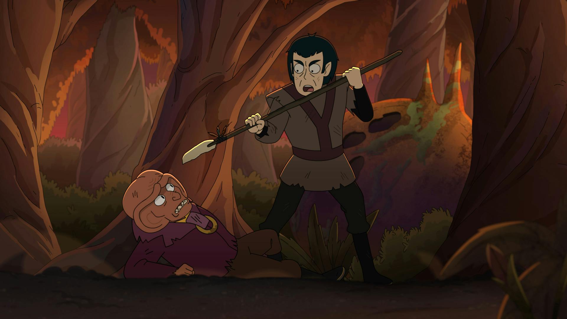 Both marooned on Sherbal V, the dishelved Romulan Vrek holds his spear at the face of the fallen Ferengi Gem who leans back on his forearm in 'The Inner Fight'